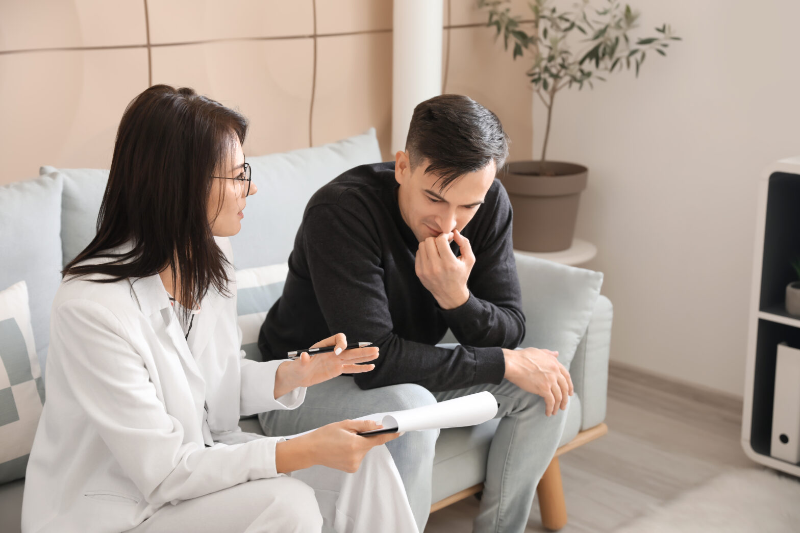man discussing issues with therapist